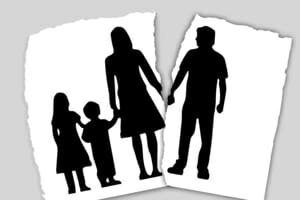 Family silhouette being torn in half | Naperville Divorce Attorney